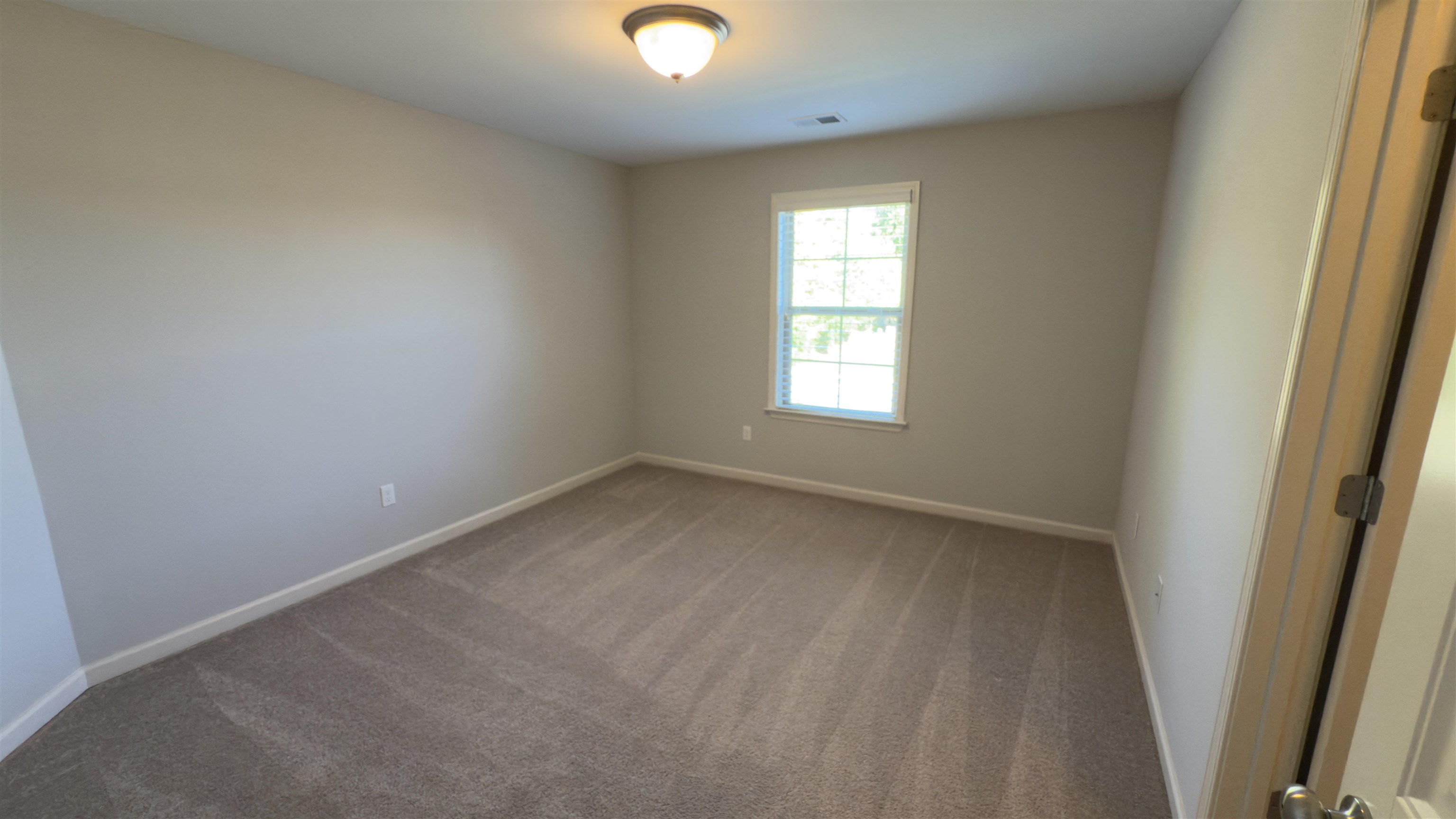 1217 Pilgrim Ridge Road Collierville, TN 38017 - Photo 25 of 33 Carpeted empty room with baseboards
