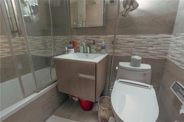 a bathroom with a toilet and a sink