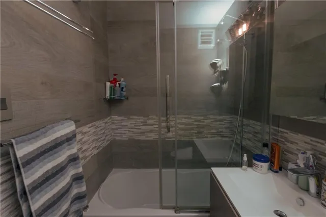 a bathroom with a sink and a shower