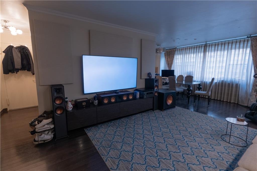 464 Neptune Avenue, Unit 3F Brooklyn, NY 11224 - Photo 5 of 15 a living room with furniture and a flat screen tv