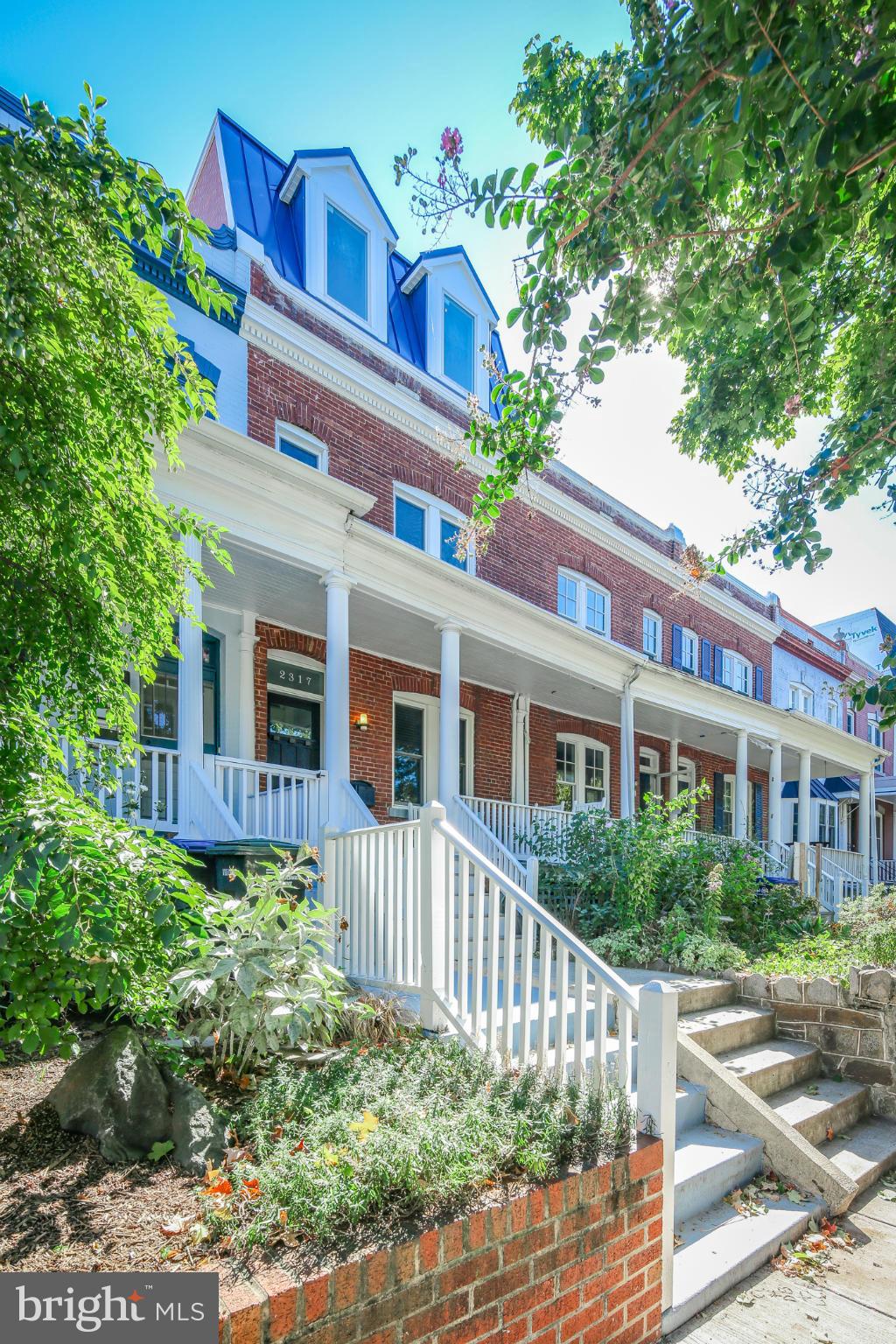 2317 Ontario Road Northwest Washington, DC 20009 - Photo 2 of 30 a front view of a house with a garden