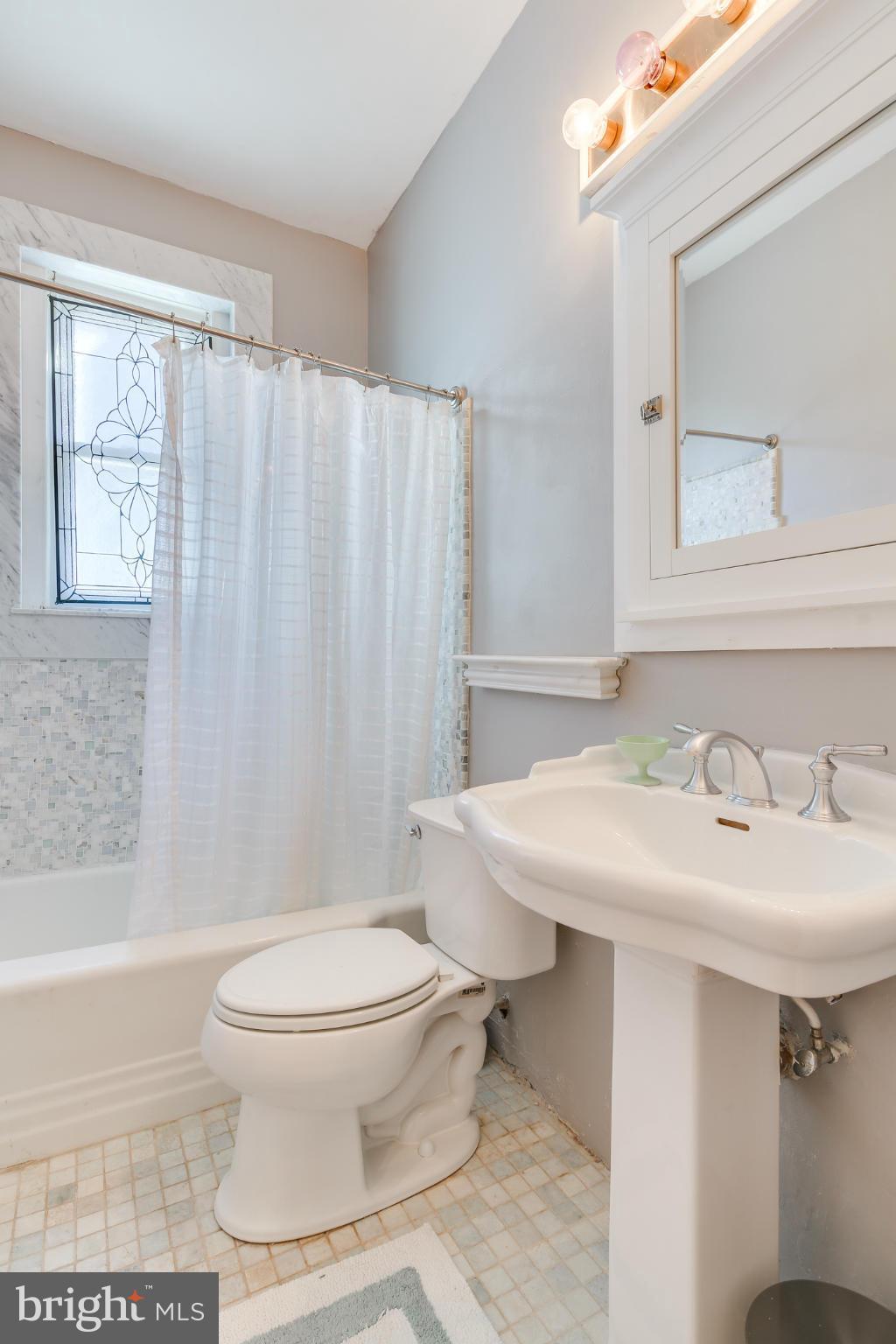 2317 Ontario Road Northwest Washington, DC 20009 - Photo 18 of 30 a bathroom with a sink toilet and shower
