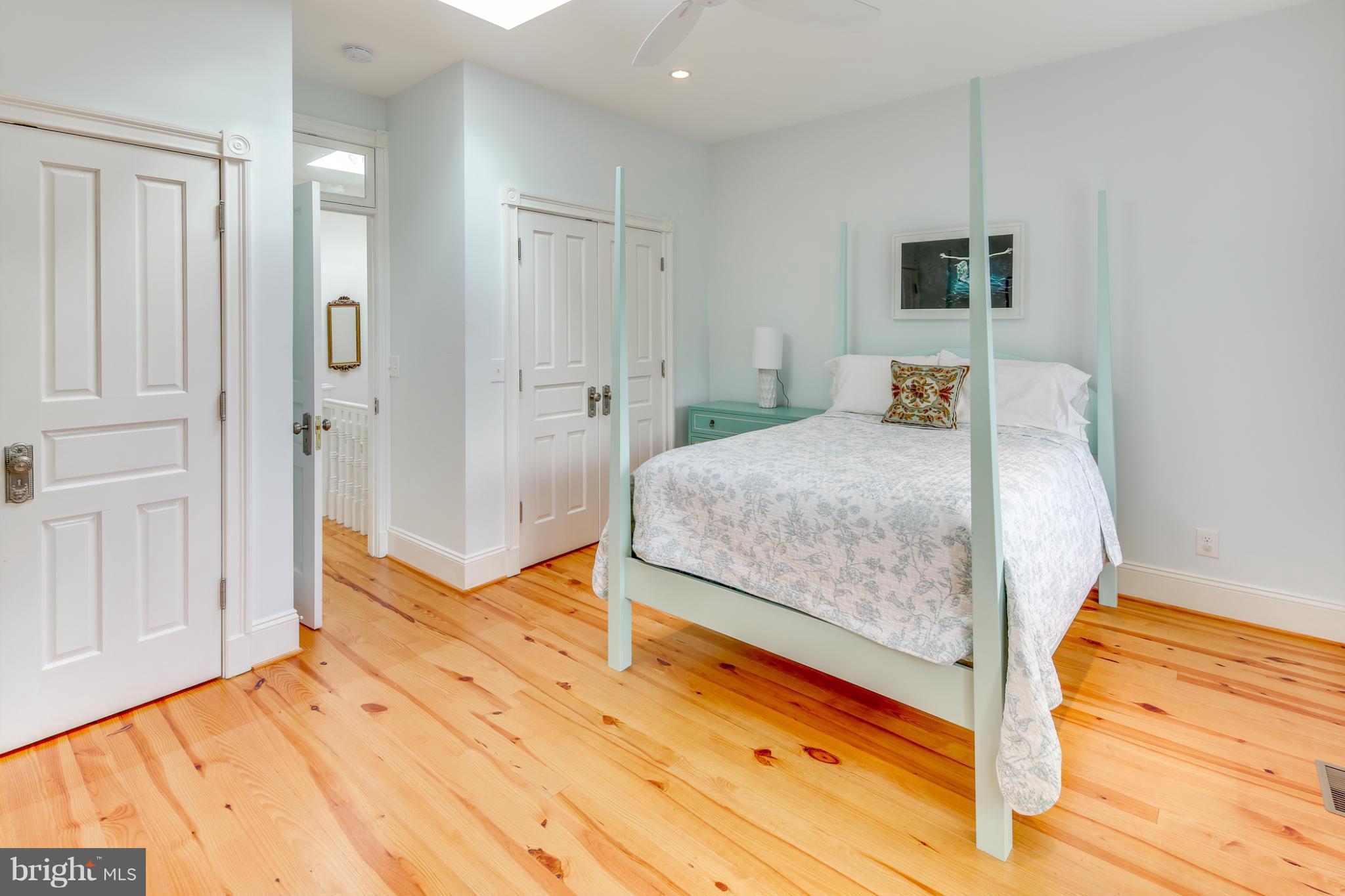2317 Ontario Road Northwest Washington, DC 20009 - Photo 20 of 30 a bedroom with a bed and a view of bathroom