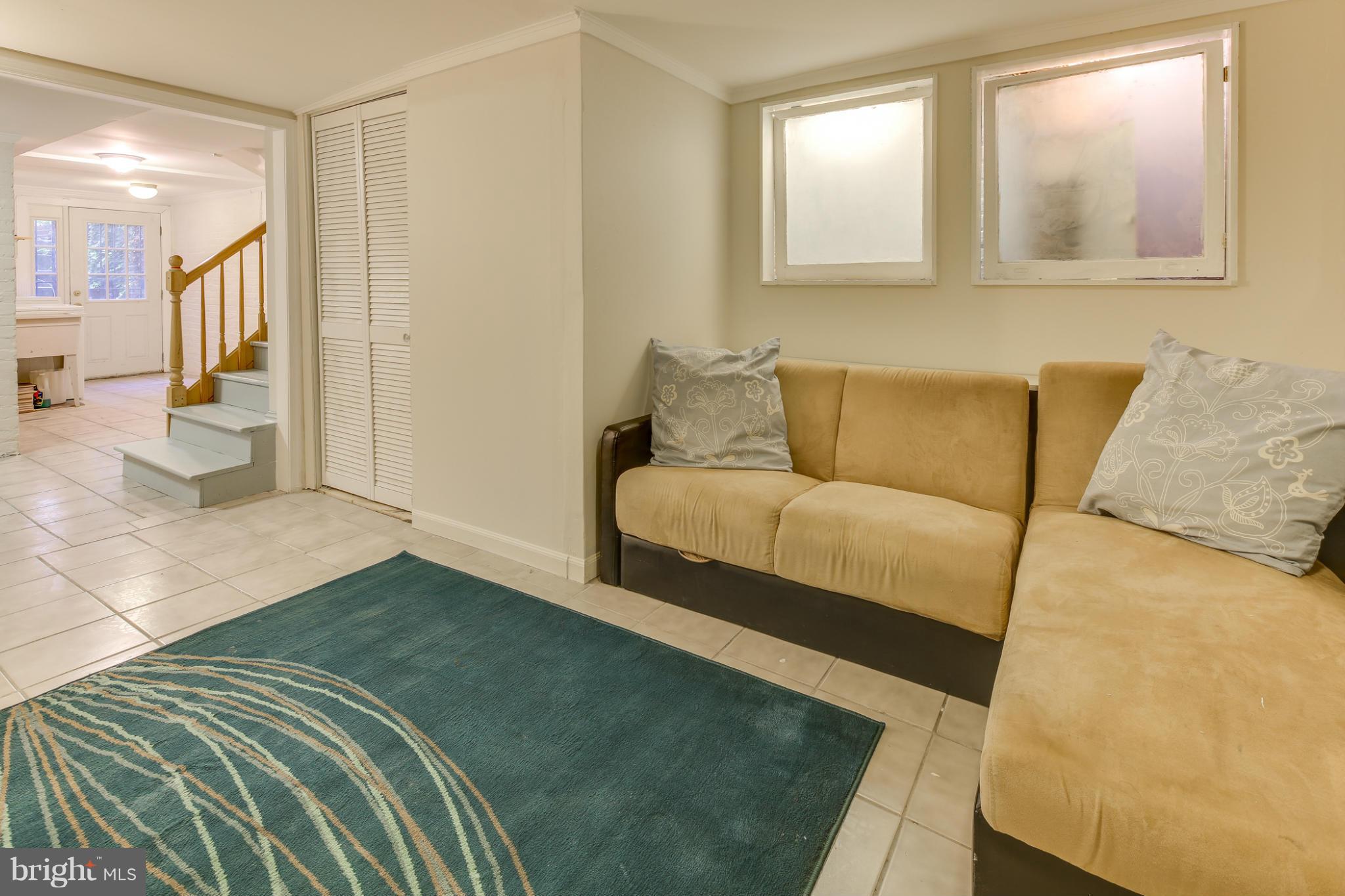 2317 Ontario Road Northwest Washington, DC 20009 - Photo 25 of 30 a bedroom with a bed and a couch