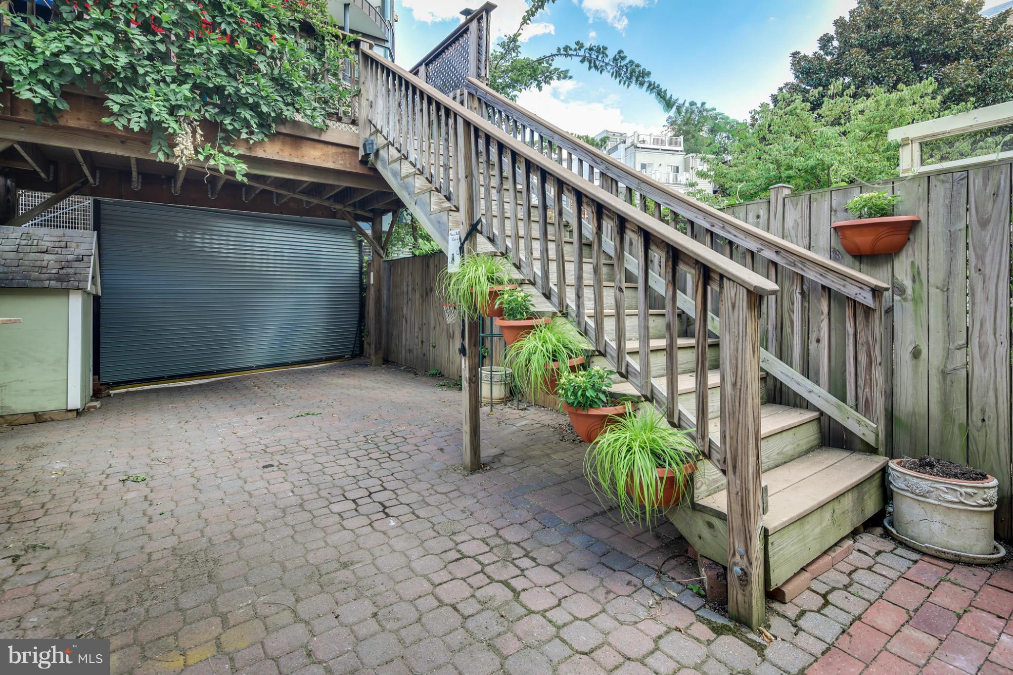 2317 Ontario Road Northwest Washington, DC 20009 - Photo 27 of 30 a view of a house with backyard and stairs