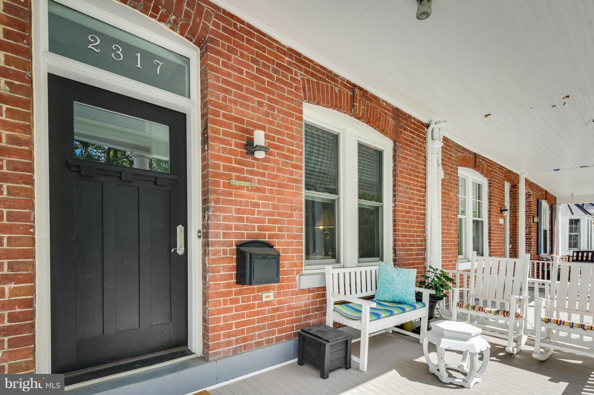 2317 Ontario Road Northwest Washington, DC 20009 - Photo 4 of 30 a balcony with furniture and potted plants