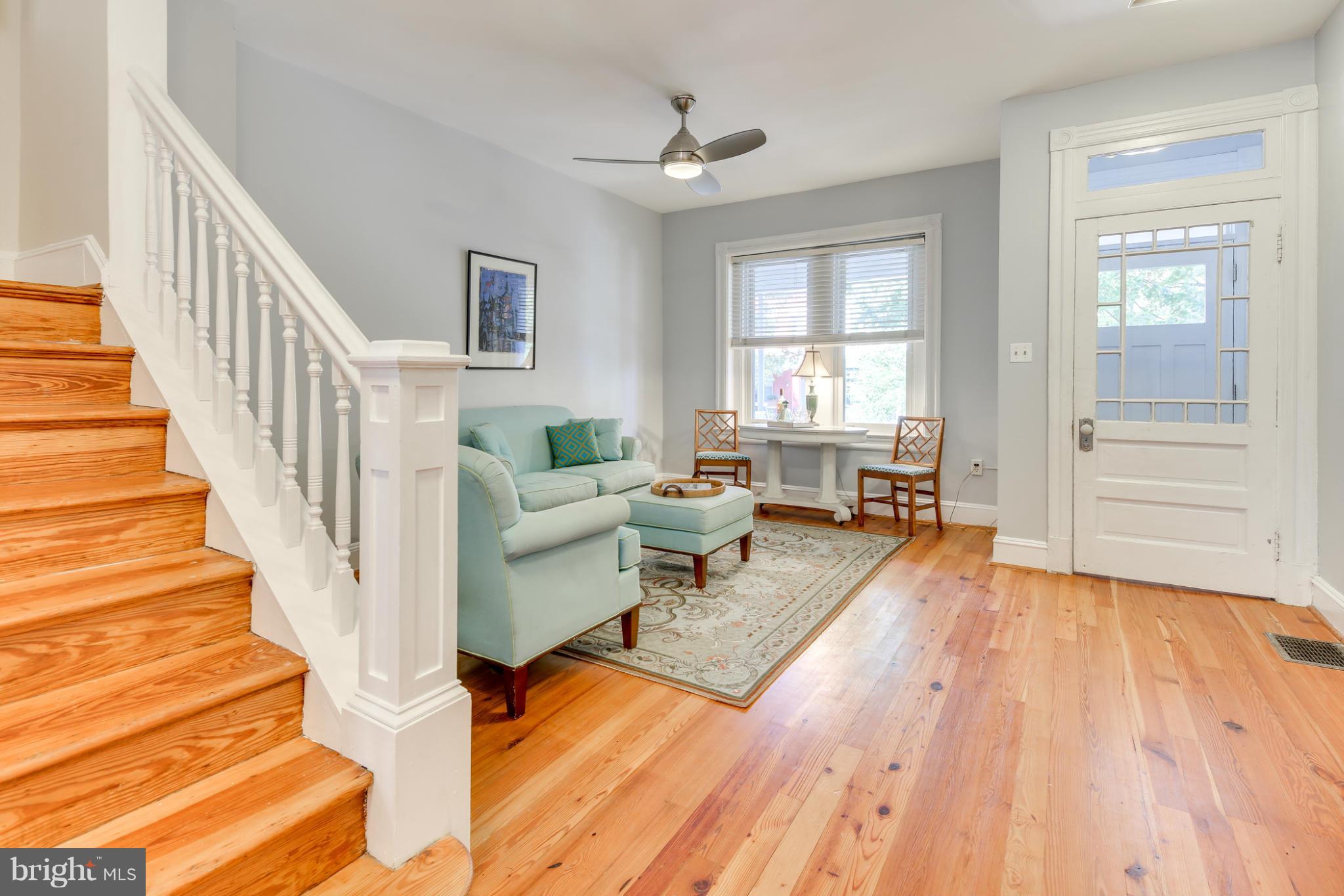 2317 Ontario Road Northwest Washington, DC 20009 - Photo 5 of 30 a living room with wooden floors and a white walls