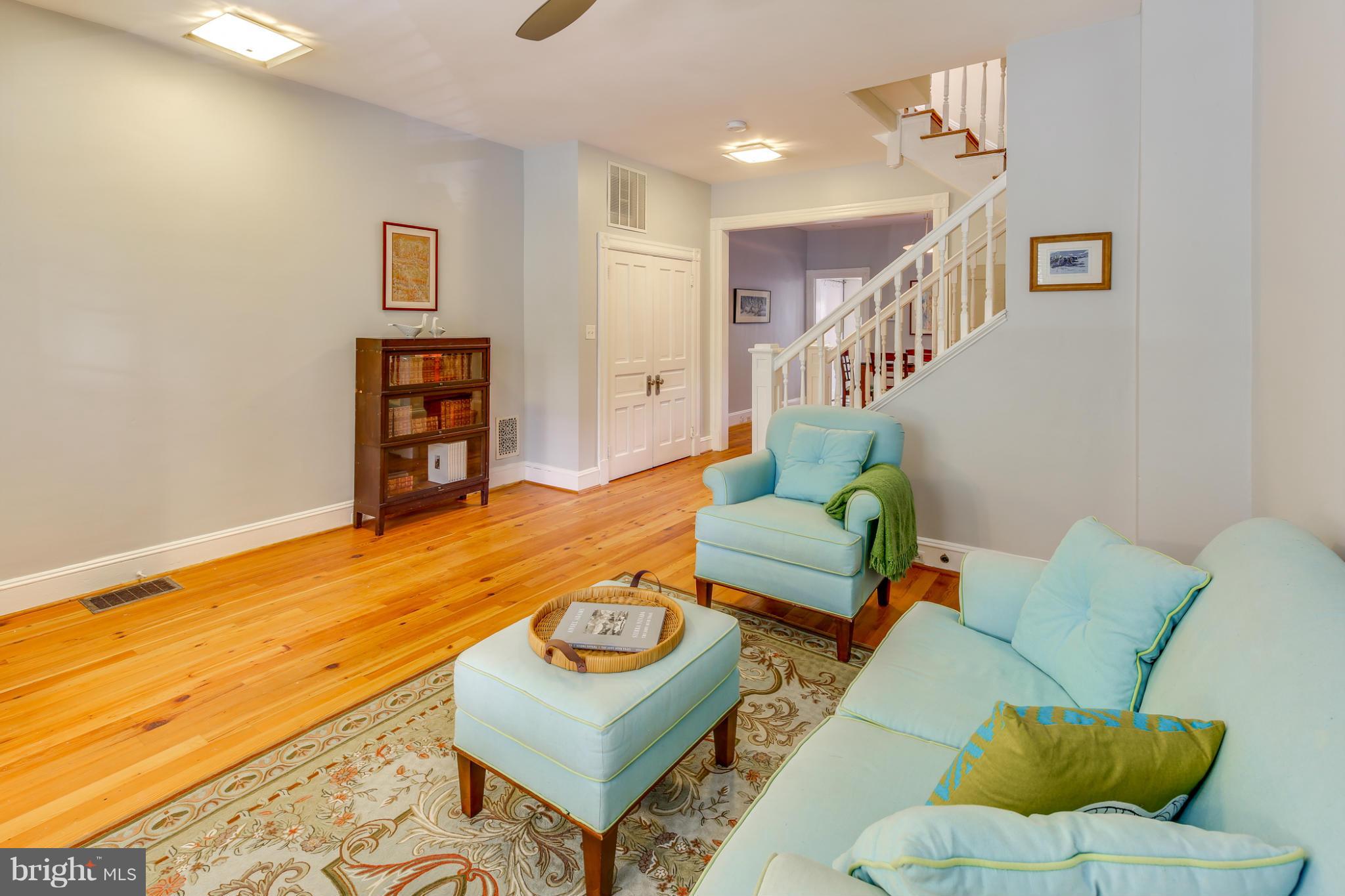 2317 Ontario Road Northwest Washington, DC 20009 - Photo 7 of 30 a living room with furniture and a wooden floor
