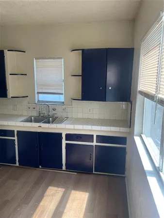 a view of two sink and a mirror