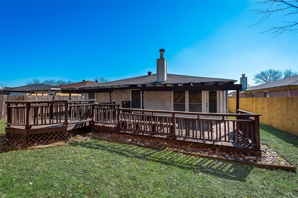 8129 Spruce Valley Drive Fort Worth, TX 76137 - Photo 18 of 19 a view of a house with a yard