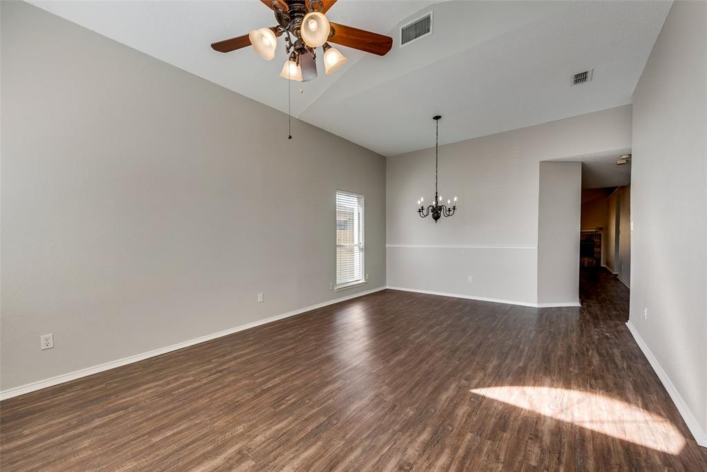 8129 Spruce Valley Drive Fort Worth, TX 76137 - Photo 4 of 19 wooden floor in an empty room with a window