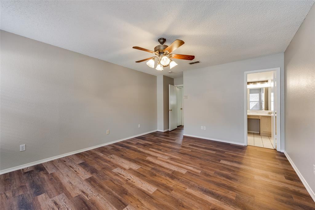 8129 Spruce Valley Drive Fort Worth, TX 76137 - Photo 10 of 19 a view of an empty room with a chandelier fan