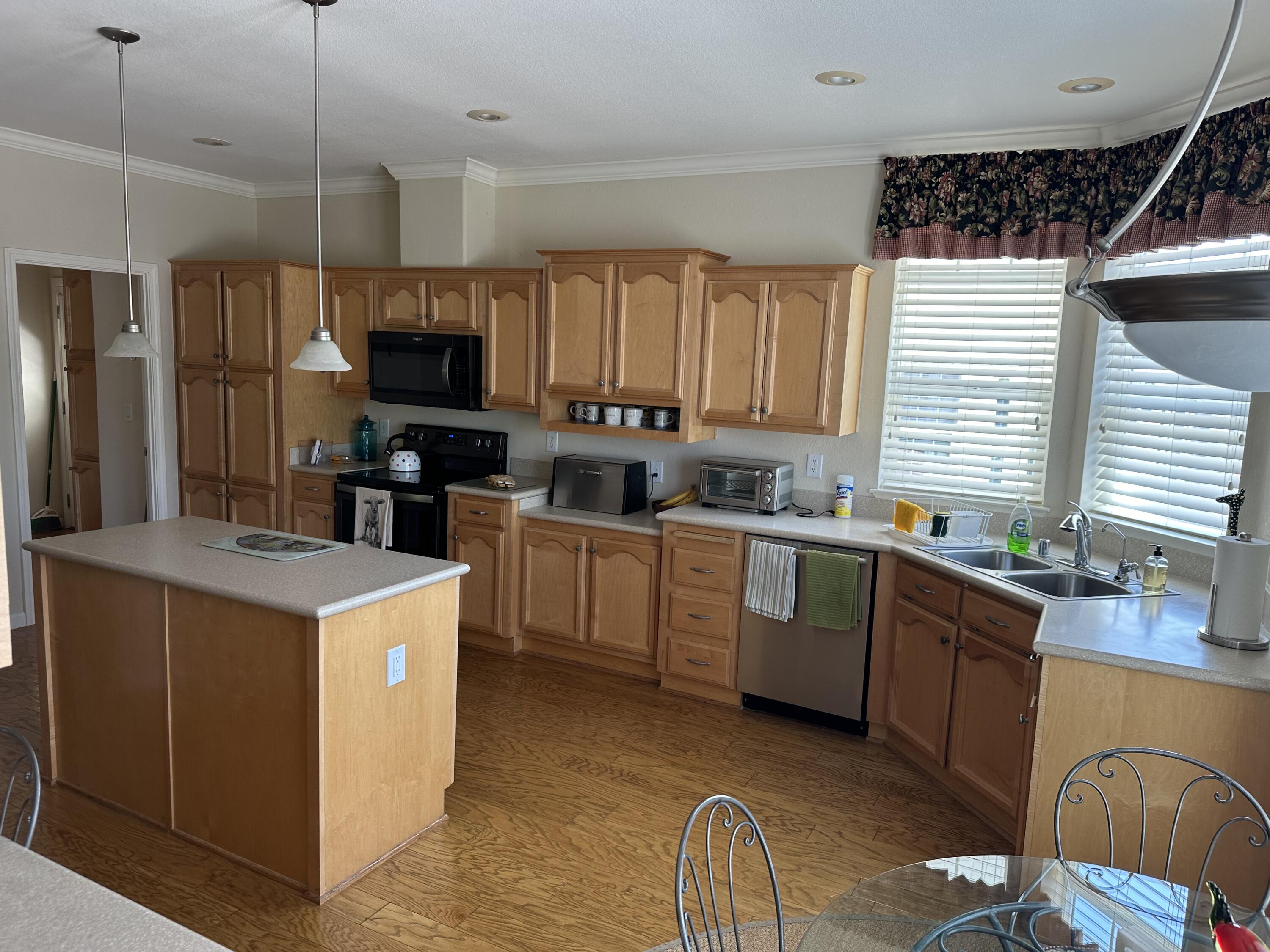 72 Alta Vista Solvang, CA 93463 - Photo 11 of 36 a kitchen that has a sink a stove and a microwave