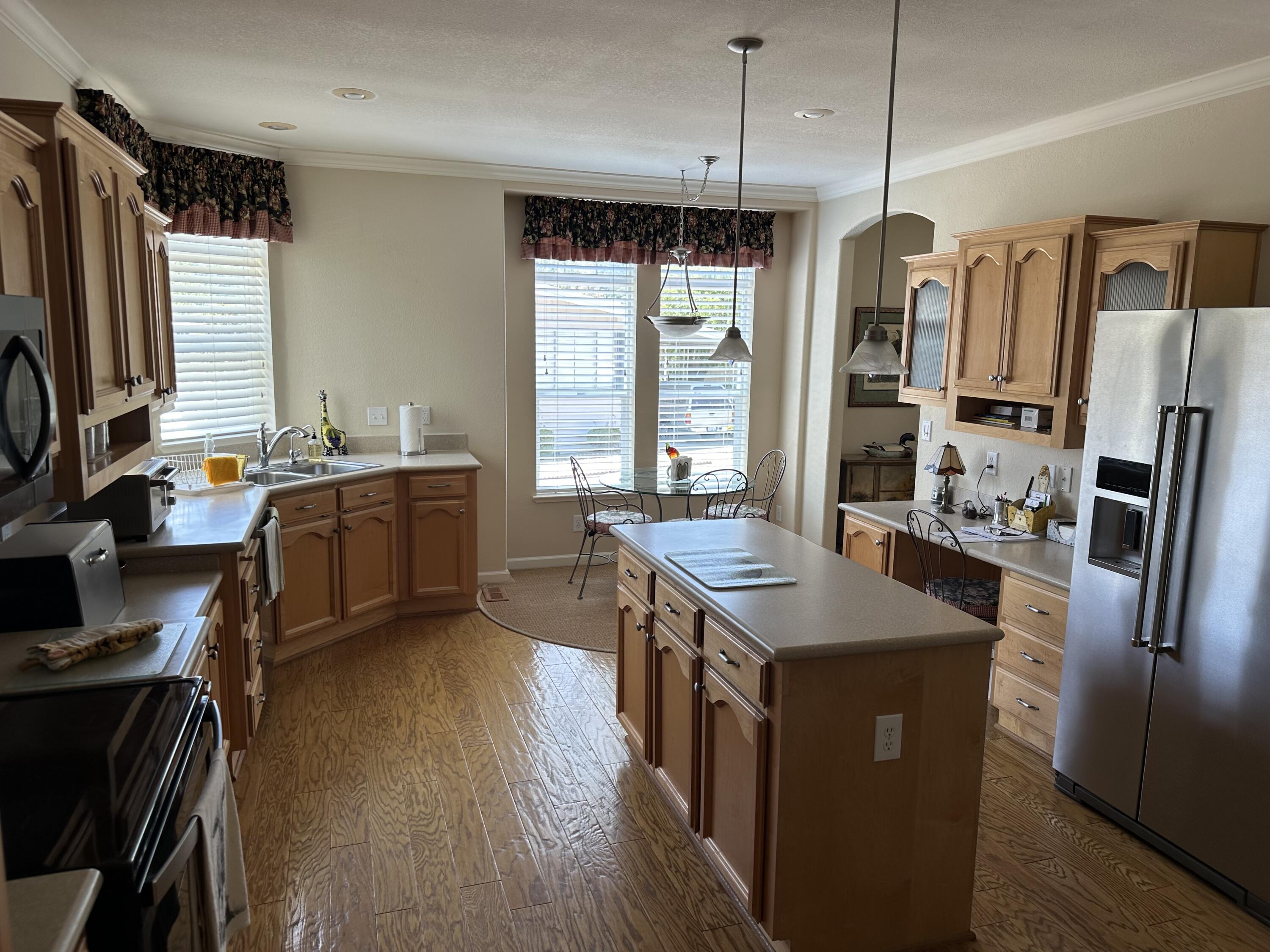 72 Alta Vista Solvang, CA 93463 - Photo 12 of 36 a kitchen with stainless steel appliances granite countertop a sink stove and refrigerator