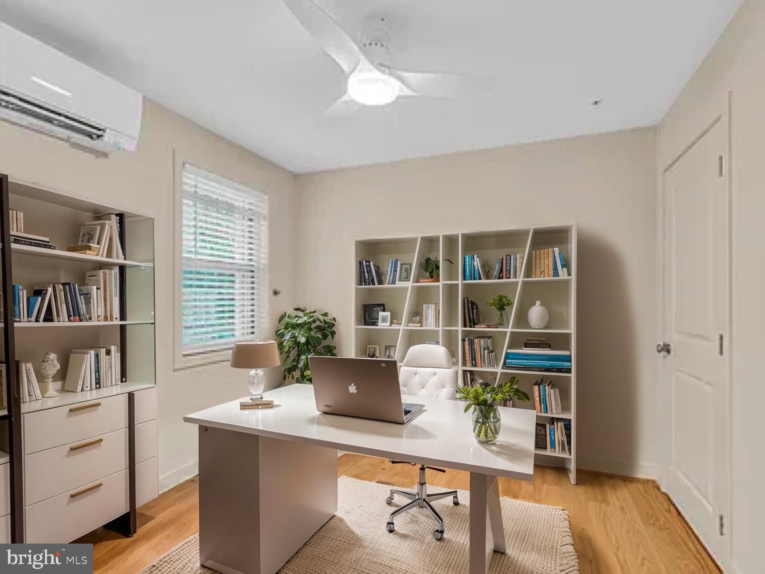 220 2nd Street Southeast, Unit 103 Washington, DC 20003 - Photo 4 of 21 a view of a workspace with furniture and wooden floor