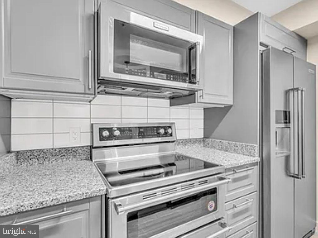 220 2nd Street Southeast, Unit 103 Washington, DC 20003 - Photo 7 of 21 a kitchen with appliances and cabinets