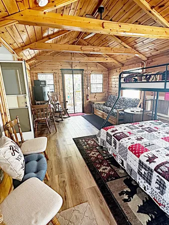 a view of a two room with wooden floor