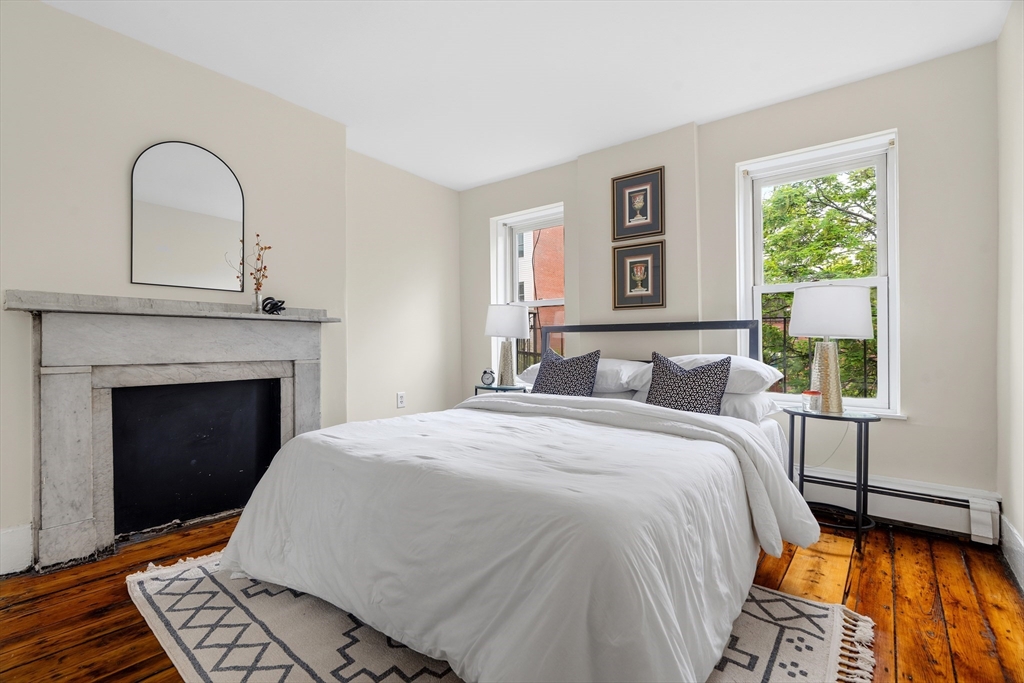 88 West Springfield Street, Unit 3 Boston, MA 02118 - Photo 11 of 17 a bed room with a bed and a fireplace