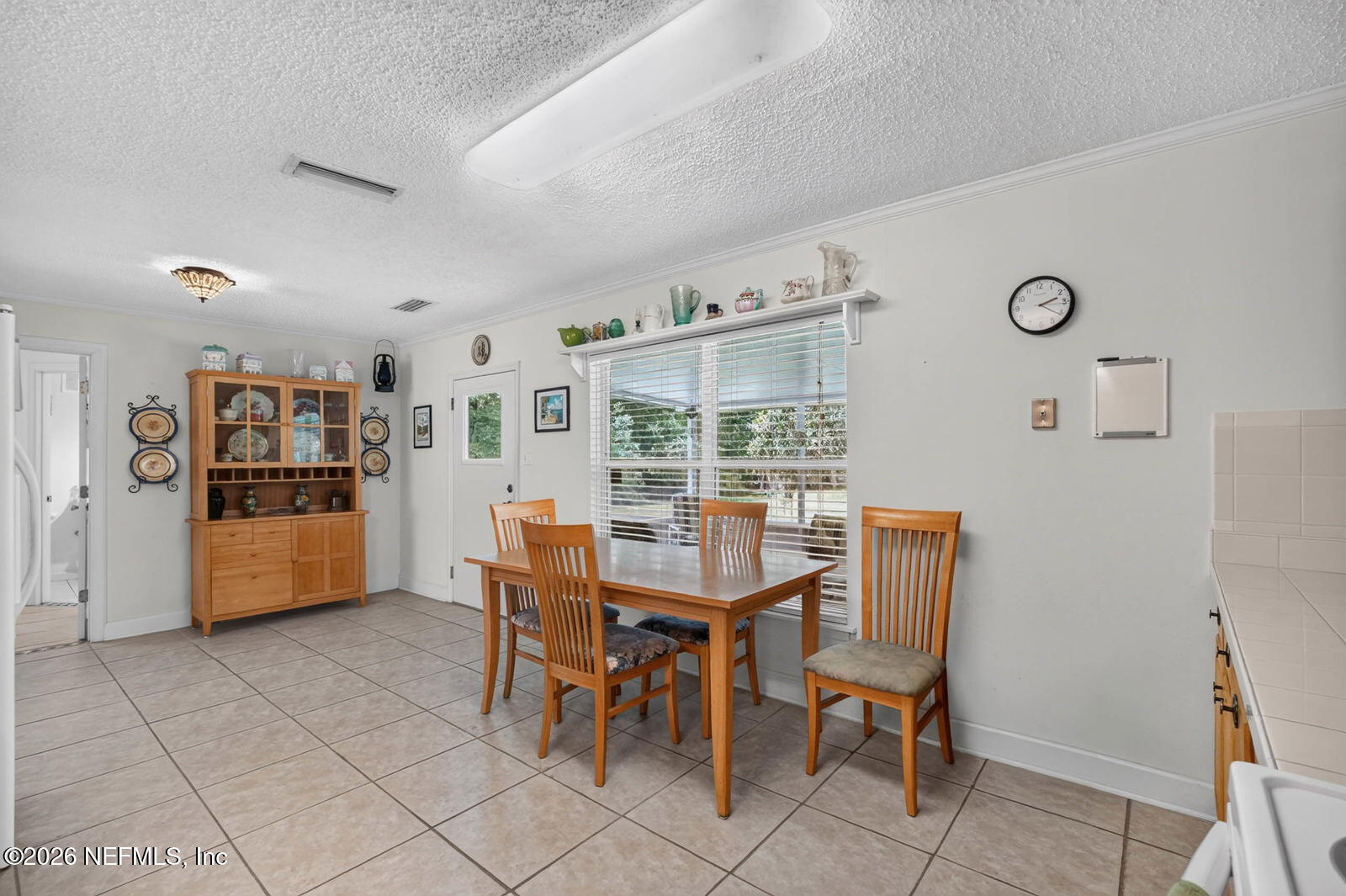 1950 Lightsey Road St. Augustine, FL 32084 - Photo 18 of 57 a view of a dining room with furniture and a kitchen
