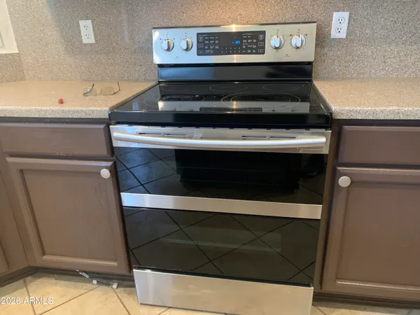 a kitchen with a sink and a refrigerator
