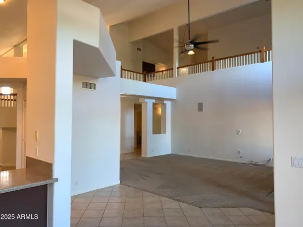 a front view of a house with entryway and wooden floor
