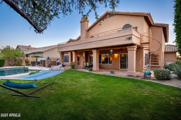 a view of a backyard with sitting area