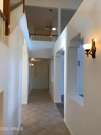 a kitchen with a sink a stove top oven and wooden floor