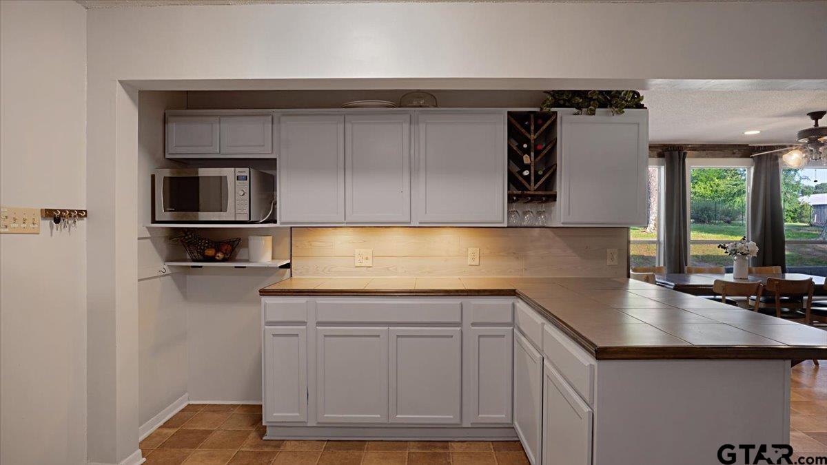 8192 County Road 428 Tyler, TX 75704 - Photo 15 of 38 a kitchen with a sink and cabinets