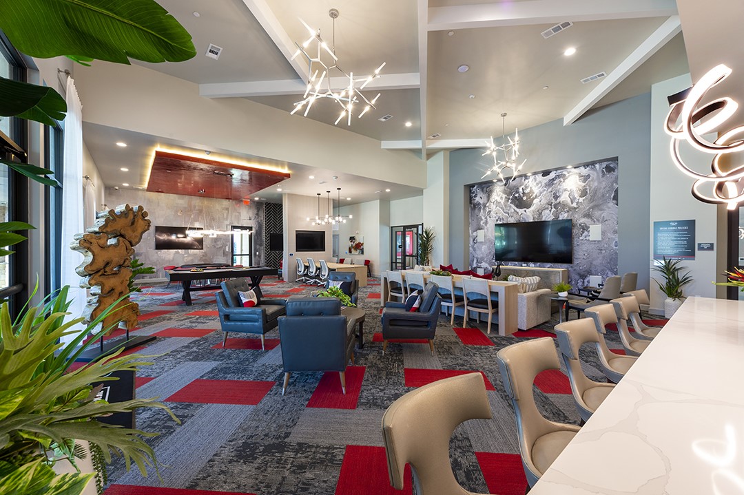 30020 Creekside Ter Drive, Unit 2114 Spring, TX 77386 - Photo 18 of 23 a living room filled with furniture and a flat screen tv