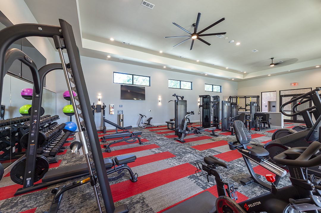 30020 Creekside Ter Drive, Unit 2114 Spring, TX 77386 - Photo 22 of 23 a view of a room with gym equipment