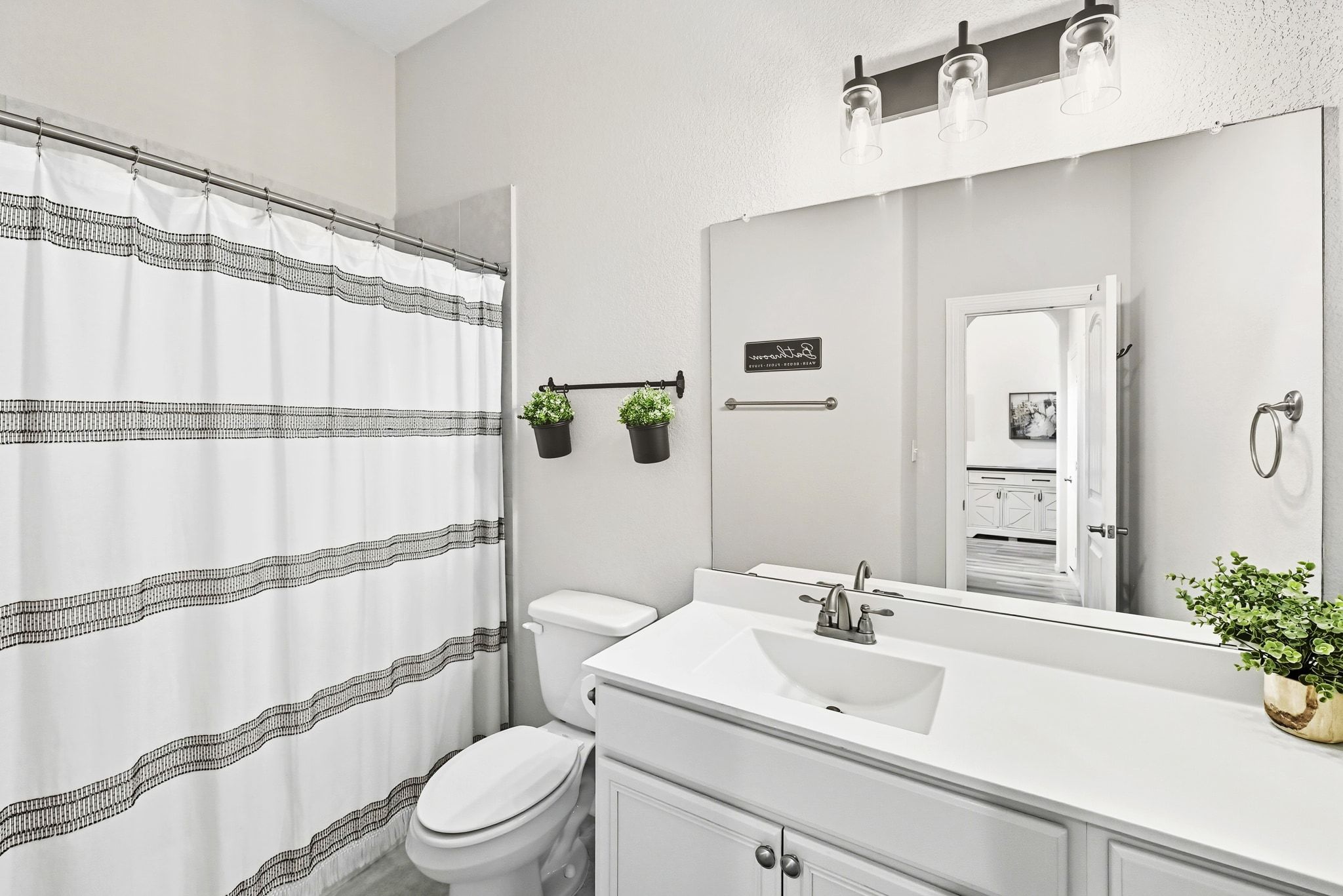 19620 Stanton Drew Pflugerville, TX 78660 - Photo 21 of 33 Bathroom featuring curtained shower and vanity