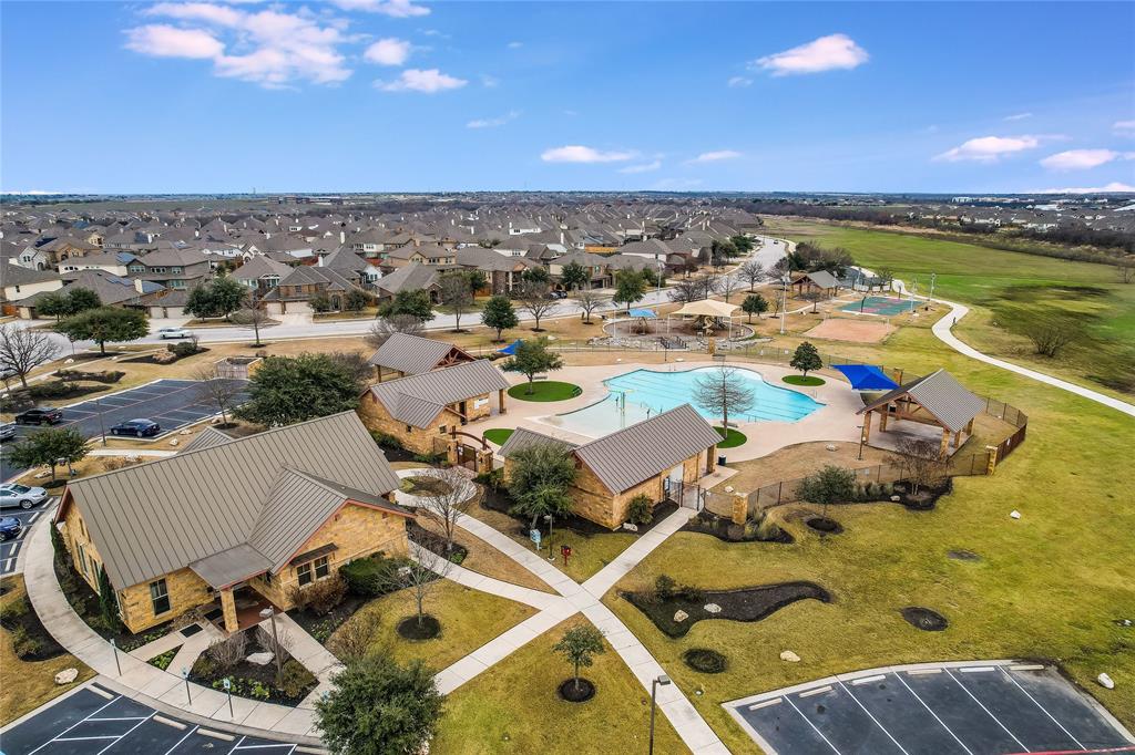 19620 Stanton Drew Pflugerville, TX 78660 - Photo 32 of 33 Aerial view of residential area with a pool