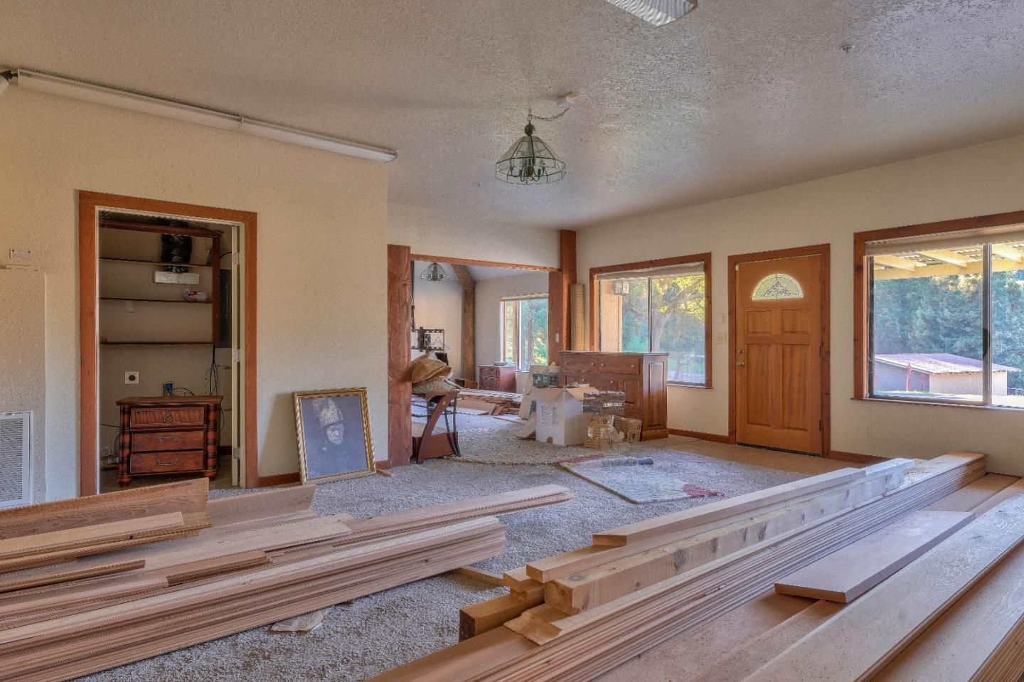 384 Corral De Tierra Road Salinas, CA 93908 - Photo 11 of 31 a living room with furniture windows and wooden floor
