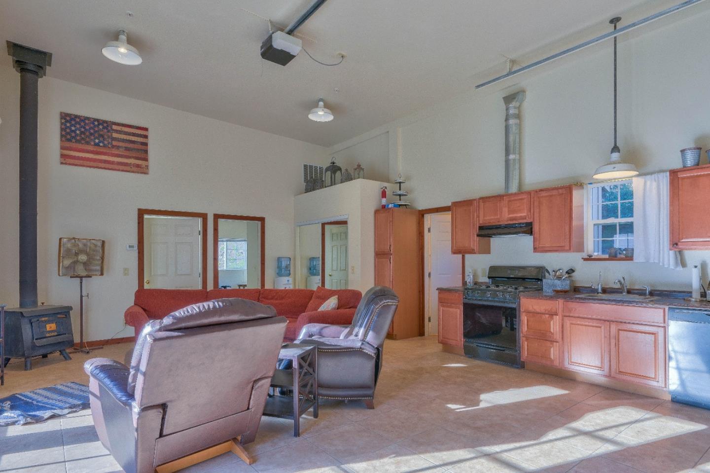 384 Corral De Tierra Road Salinas, CA 93908 - Photo 20 of 31 a bedroom with furniture and a chandelier