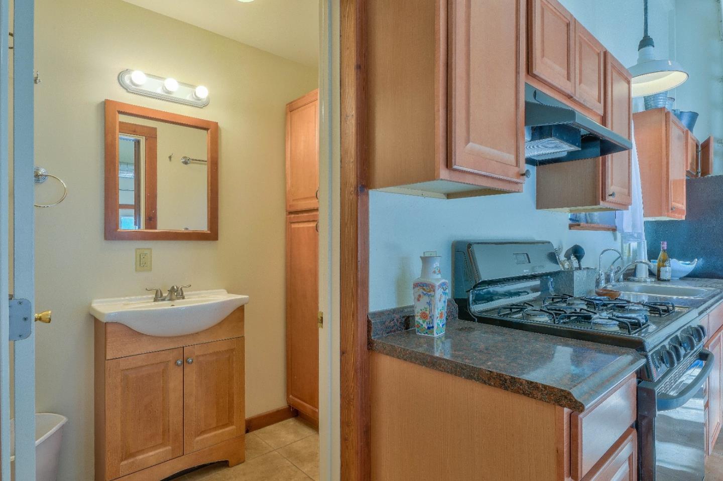 384 Corral De Tierra Road Salinas, CA 93908 - Photo 22 of 31 a kitchen with stainless steel appliances granite countertop a sink a stove and cabinets