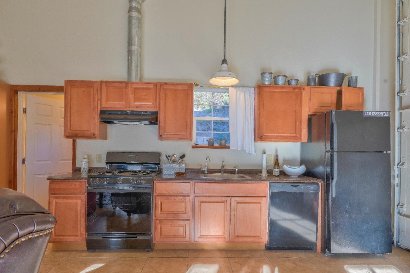 384 Corral De Tierra Road Salinas, CA 93908 - Photo 24 of 31 a kitchen with stainless steel appliances granite countertop a sink stove and refrigerator