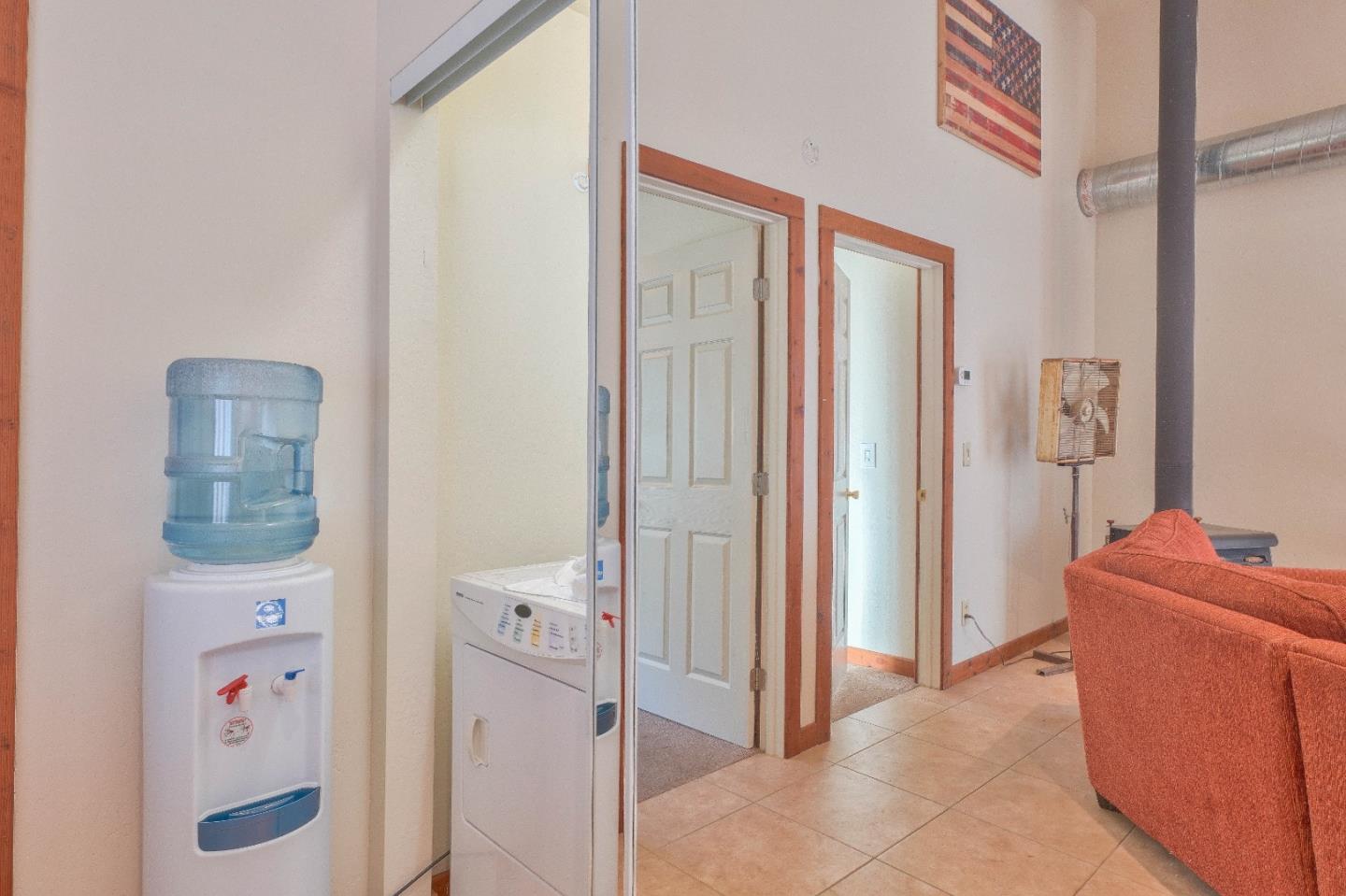 384 Corral De Tierra Road Salinas, CA 93908 - Photo 27 of 31 a room with a door and a couch