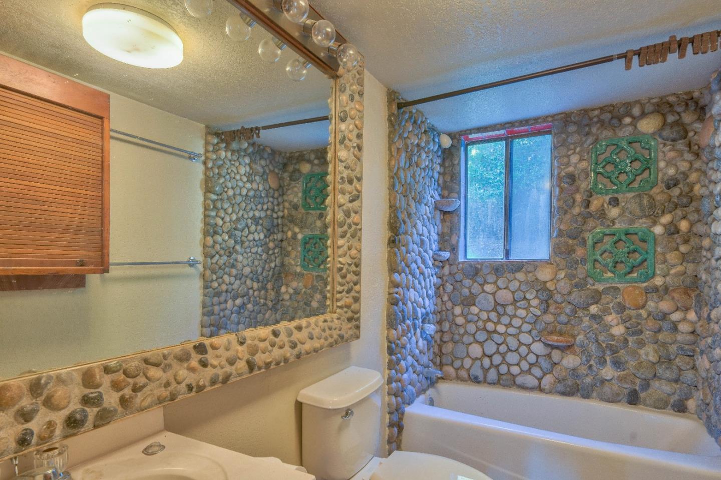 384 Corral De Tierra Road Salinas, CA 93908 - Photo 9 of 31 a bathroom with a toilet sink and shower