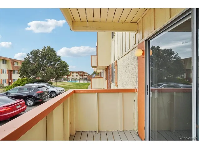 a view of a building with a yard