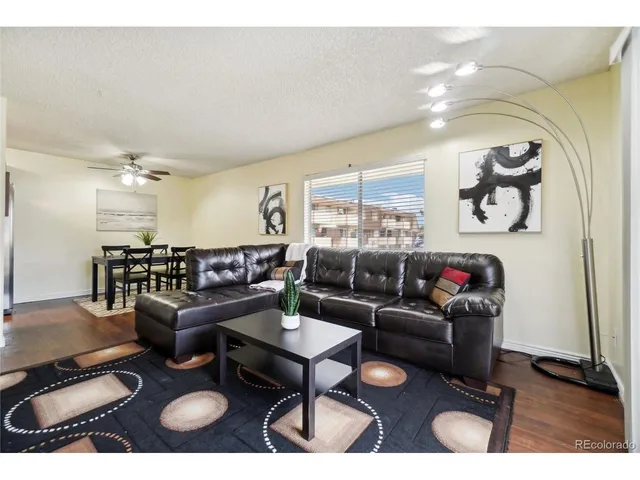 a living room with furniture and a table