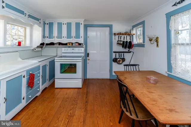 a kitchen with stainless steel appliances granite countertop a stove and a refrigerator