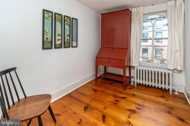 a view of a livingroom with furniture and staircase