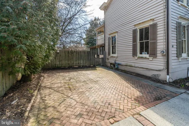 a view of a backyard with pathway