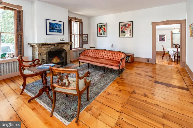 a bedroom with furniture and a fireplace