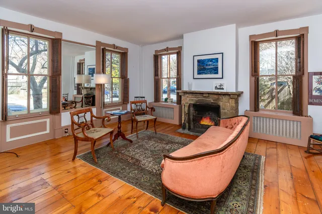 a living room with furniture rug and window