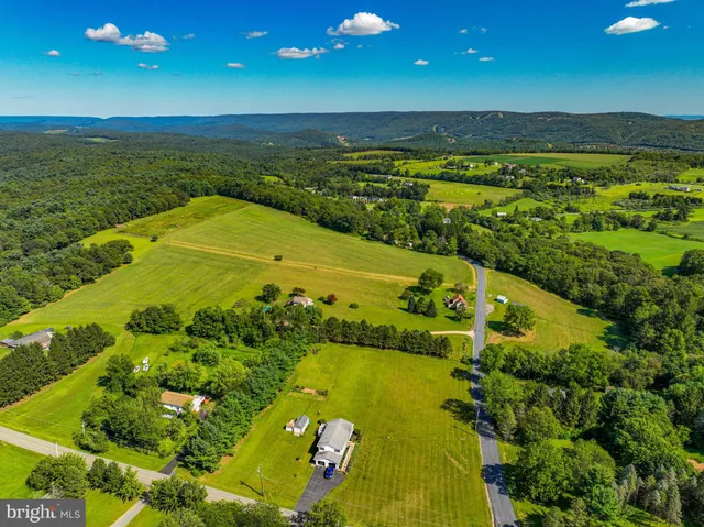 a view of an ocean and a yard