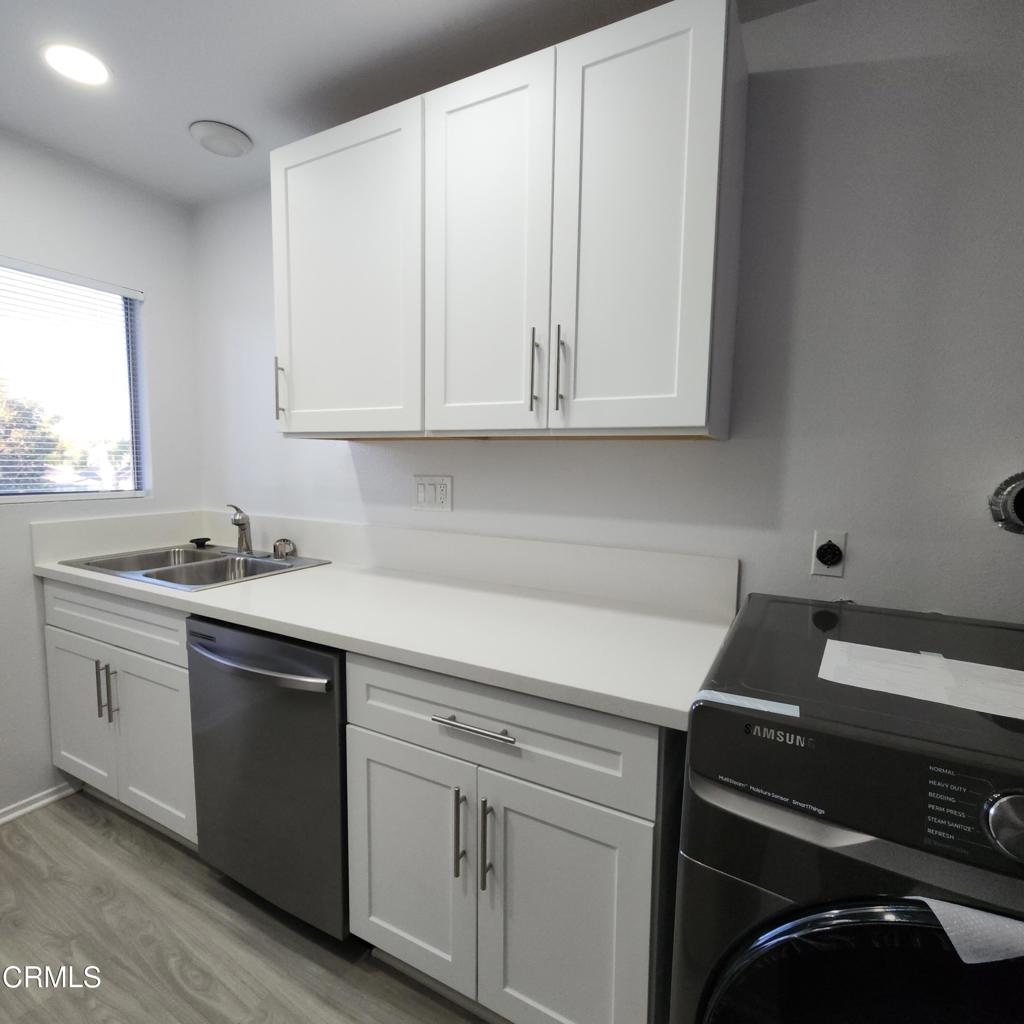 209 South Ventura Road, Unit 36 Port Hueneme, CA 93041 - Photo 17 of 35 a kitchen with a sink and cabinets