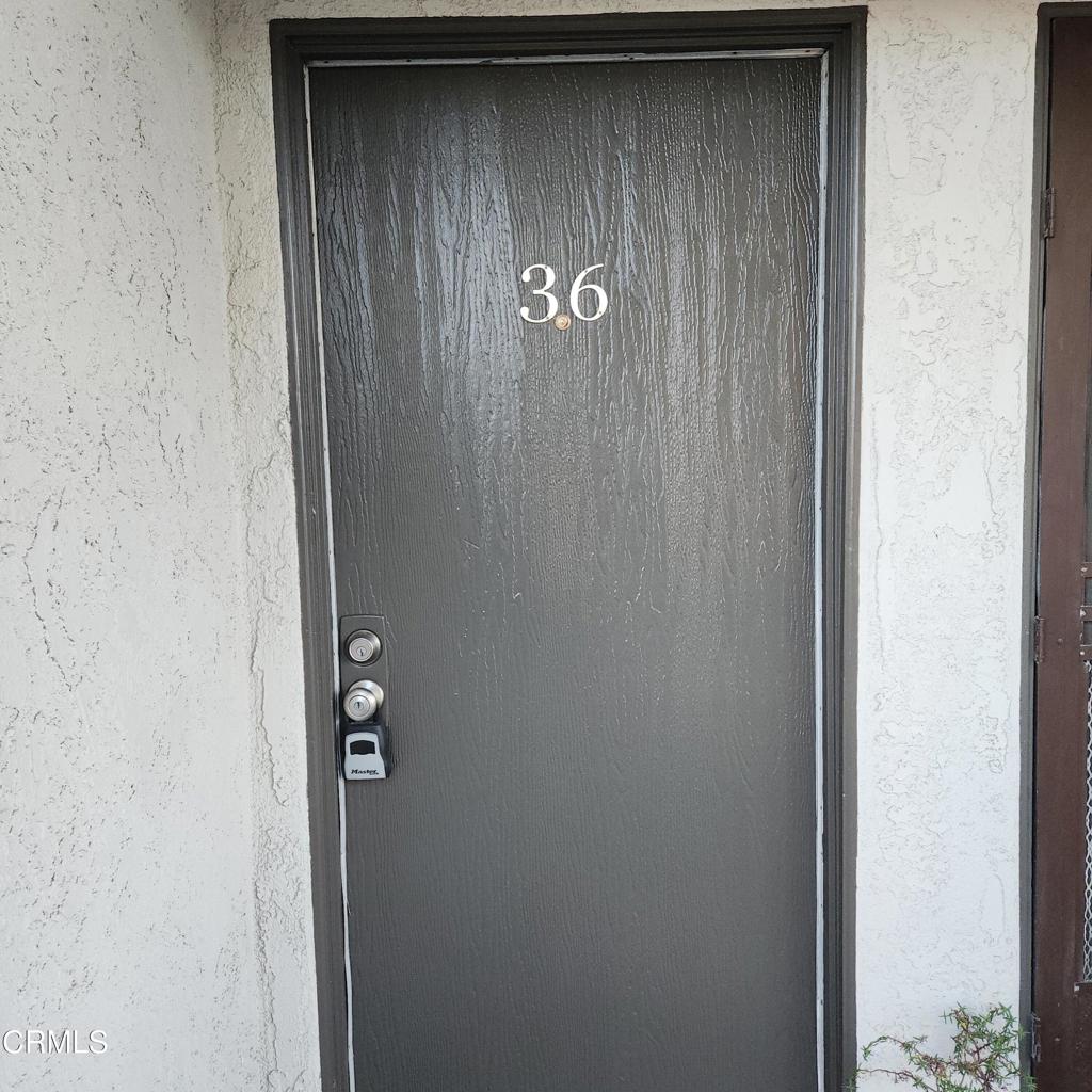 209 South Ventura Road, Unit 36 Port Hueneme, CA 93041 - Photo 2 of 35 a bathroom with a shower and a door