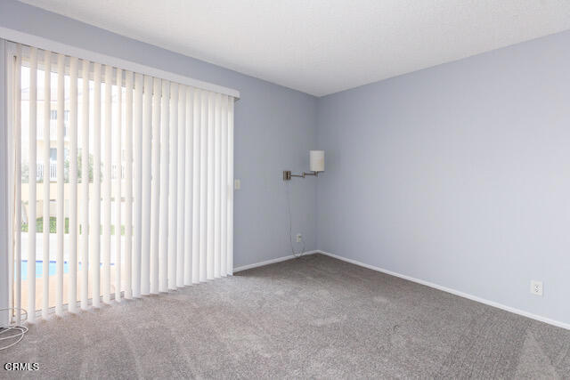 209 South Ventura Road, Unit 36 Port Hueneme, CA 93041 - Photo 7 of 35 a view of an empty room with a window