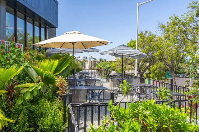 a view of a chairs and table on the wooden floor